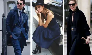 Uomo elegante in abito blu e trench, donna con abito blu e cappello, donna in nero con cappotto. L'abbinare blu e nero è un classico intramontabile.