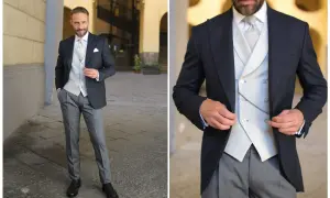 Uomo elegante in spezzato con cravatta, gilet e catenella da orologio.