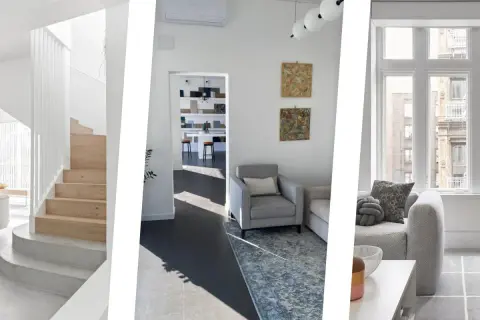 Interni moderni con scale in legno, divani grigi e tappeti che creano un'atmosfera accogliente. Ottimi colori da abbinare al grigio scuro abbigliamento.