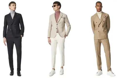 Tre uomini indossano abiti eleganti. Uno con gessato spezzato, un altro con completo nero e il terzo con giacca beige.
