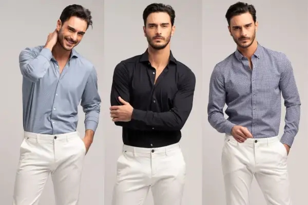 Uomo con camicie da uomo particolari: azzurra microfantasia, nera tinta unita e blu con fantasia geometrica, abbinate a pantaloni bianchi.