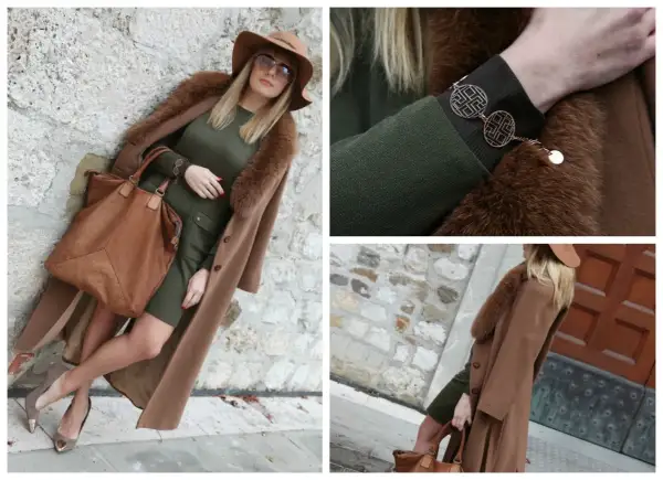 Eleganza in verde e cammello: un cappotto lungo, cappello e borsa in color cammello, abbinati a un vestito verde.
